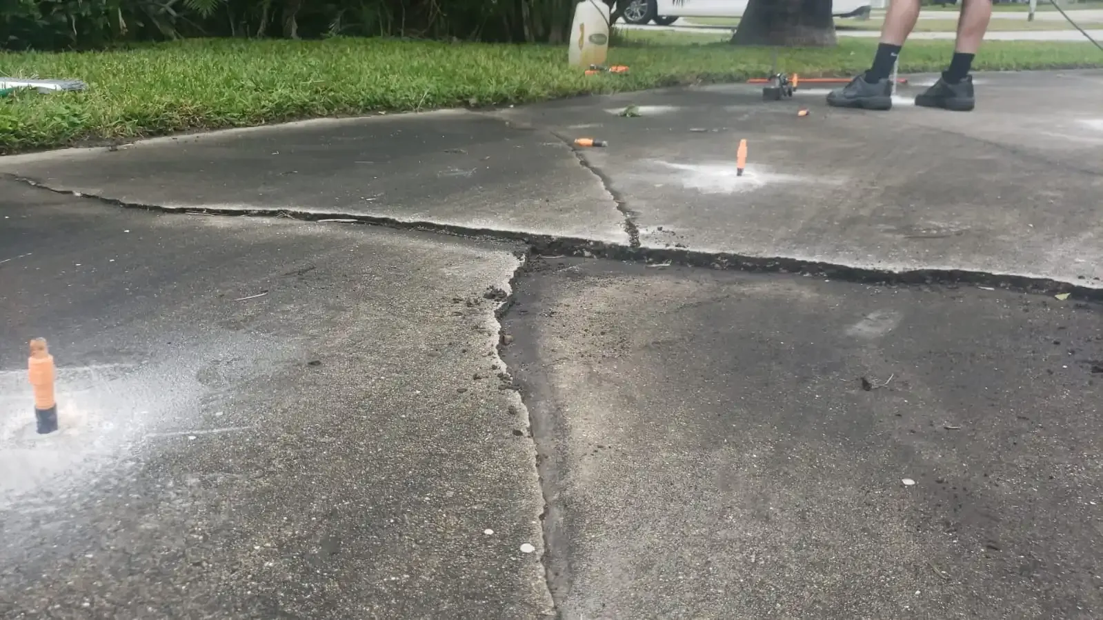 A sinking, settling driveway in need of repair